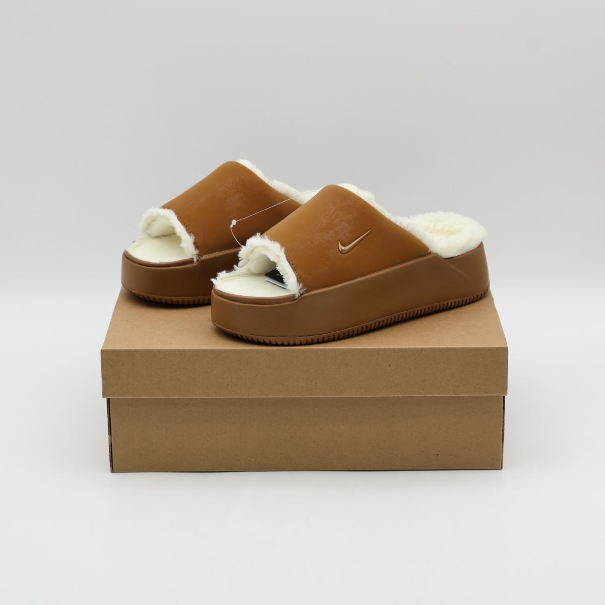 HV8560-200 Nike Calm Elevation Fur Slides Light British Tan (Women's)