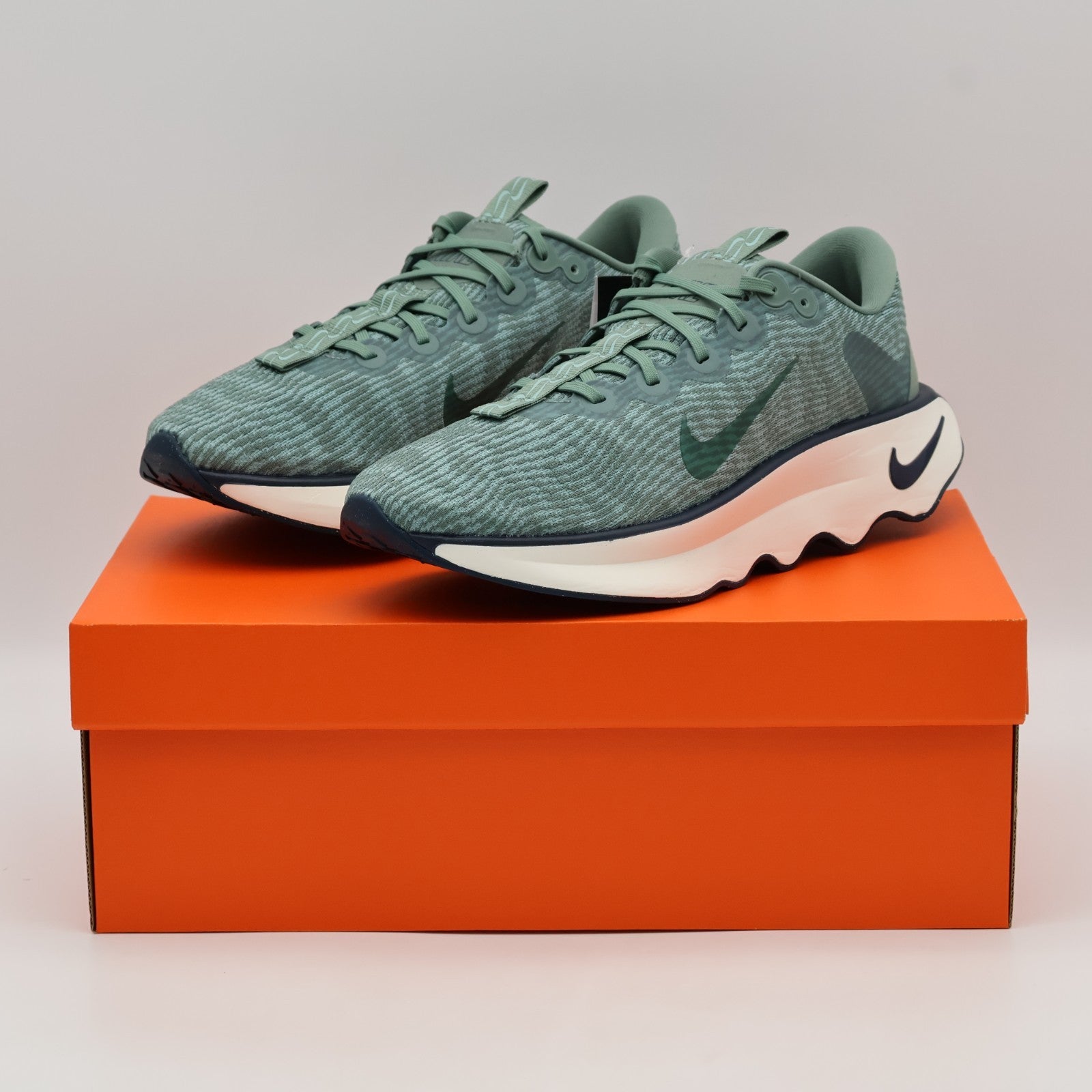 DV1237-301 Nike Motiva Clay Green Cannon Armory Navy Clay Green (Men's)