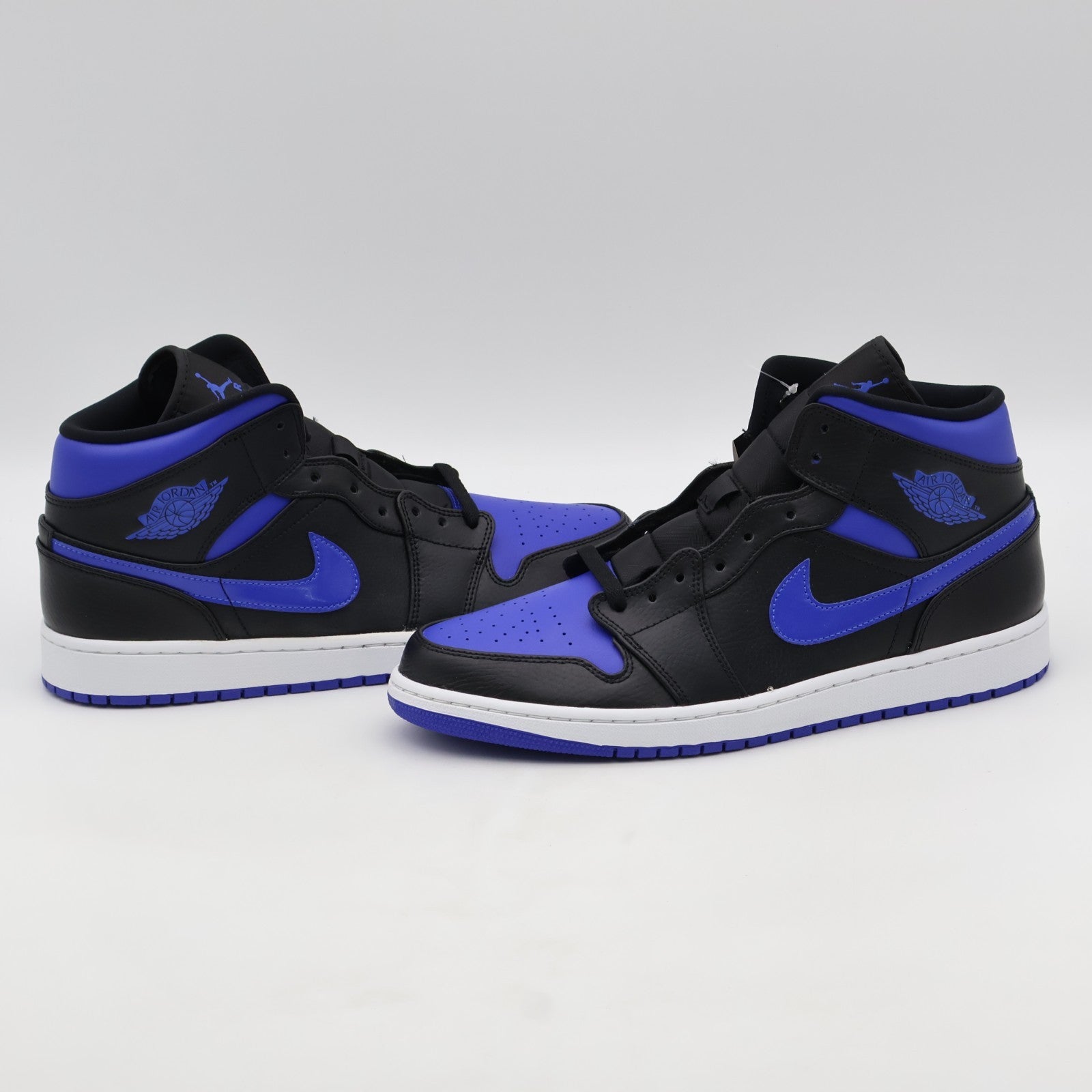 554724-068 NIKE AIR JORDAN 1 MID BLACK BLUE (Men's)