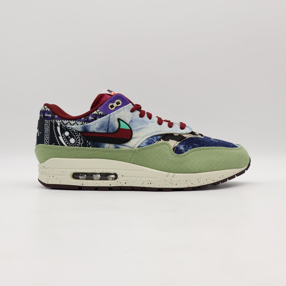 DN1803-300 Concepts Nike Air Max 1 Mellow Oil Green Black Team Red Sail (Men's)