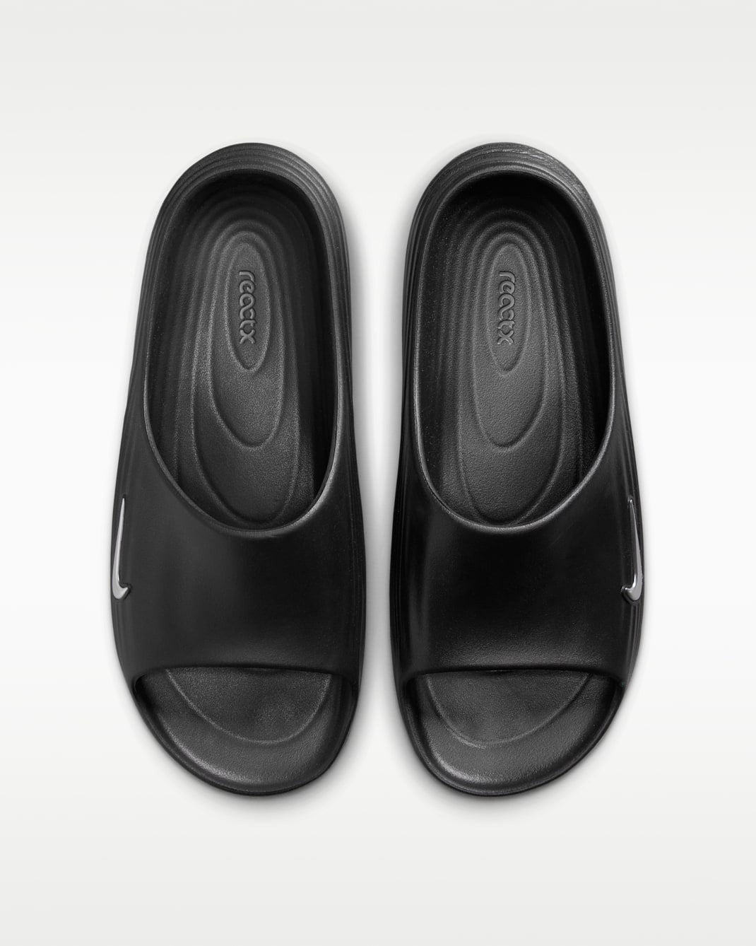 HV4479-003 HV4479-003 Nike ReactX Rejuven8 Slides BlackGamma Blue (Men's)