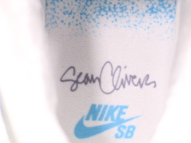 DC9936-100 Sean Cliver Ã Nike SB Dunk Low "Holiday Special" (Men's)